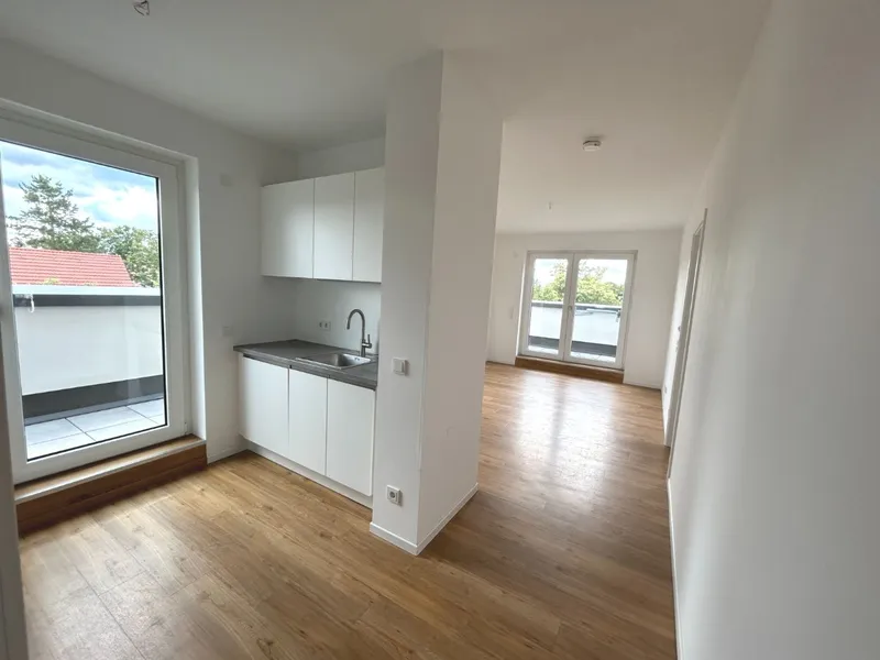 Helle 2-Zimmer-Dachgeschosswohnung mit Einbauküche, Terrasse & Abstellraum! — photo 1